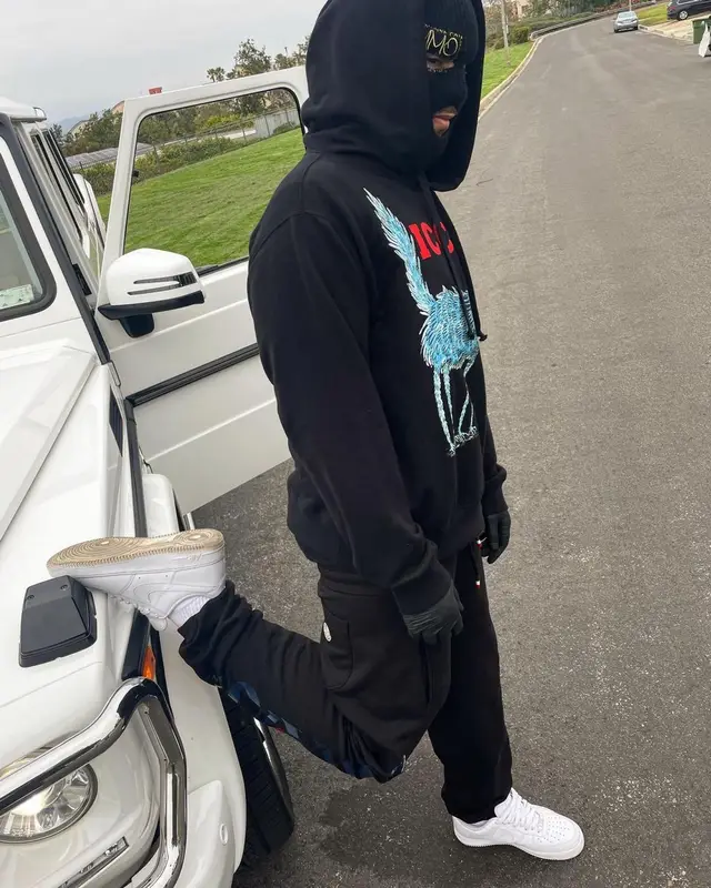 Lil Toe outfit in Gucci, Moncler, and Awake NY, 2022