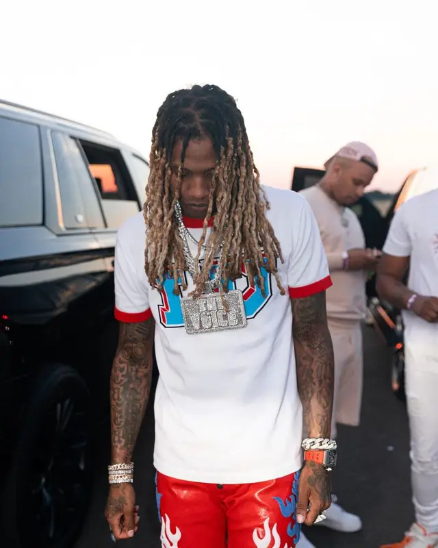 Lil Durk outfit in Louis Vuitton, RoyGBiv, and Nike, 2022