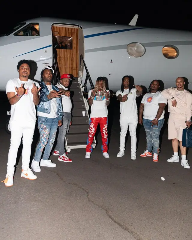 Lil Durk outfit in Louis Vuitton, RoyGBiv, and Nike, 2022