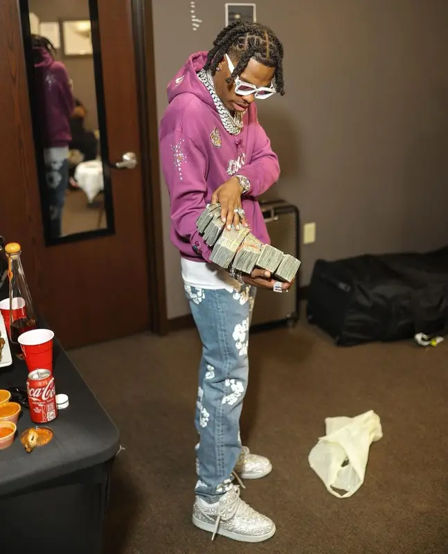 Lil Baby outfit in Chanel, Louis Vuitton, and Pharrell Williams, 2022