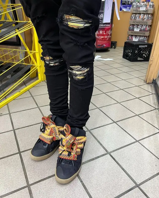 Lil Migo outfit in Off-White, Louis Vuitton, and Prada, 2022