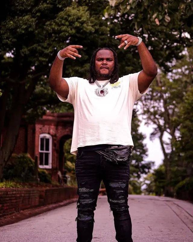 Tee Grizzley outfit in Gallery Dept., Amiri, and Saint Laurent, 2022