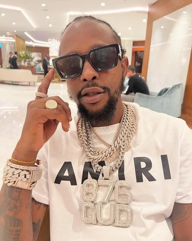 Popcaan outfit in Amiri and Louis Vuitton, 2022