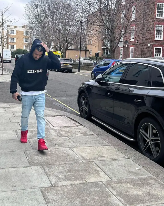 Divine outfit in Tommy Hilfiger, Fear of God, and Aape, 2022