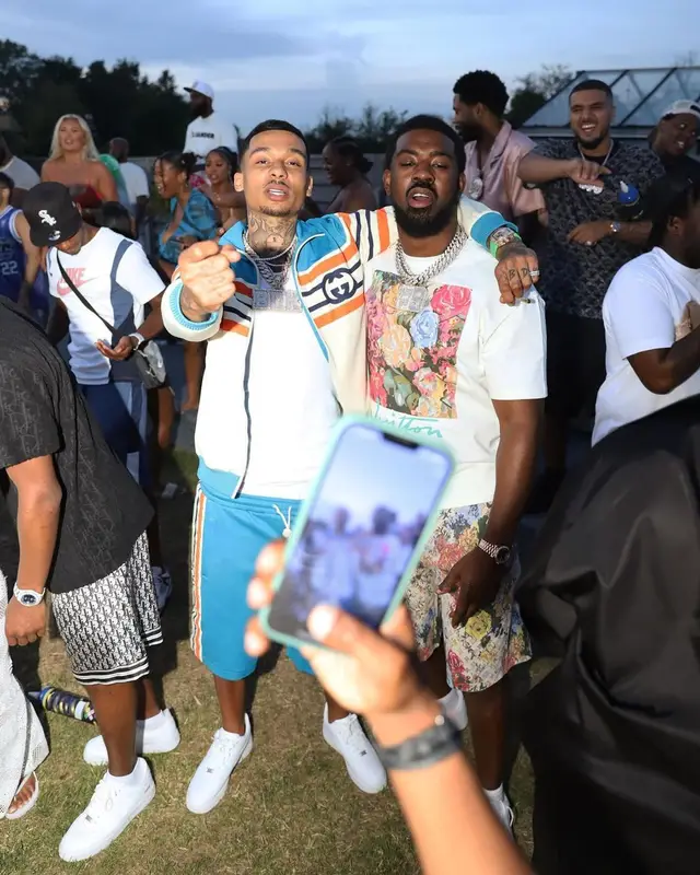 Tion Wayne outfit in Louis Vuitton and Nike, 2022