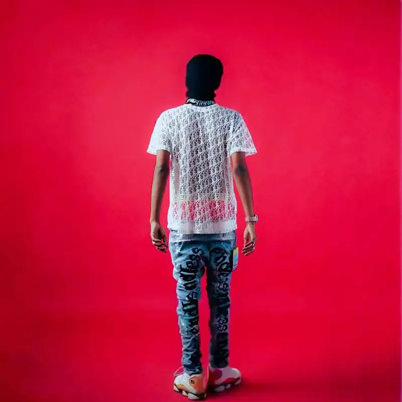 MC Stan outfit in Dior, Vlone, and Louis Vuitton, 2022