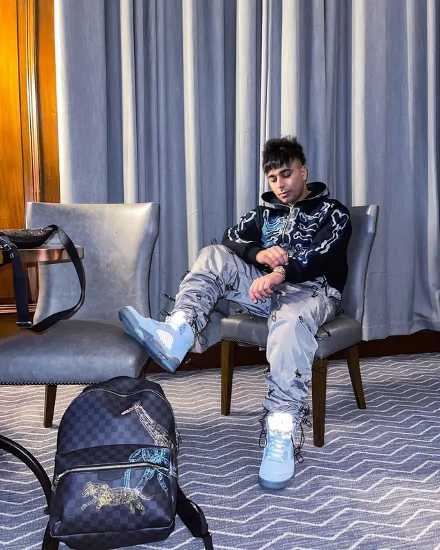 Gurinder Gill outfit in Travis Scott Merch, Jordan, and Fragment, 2022