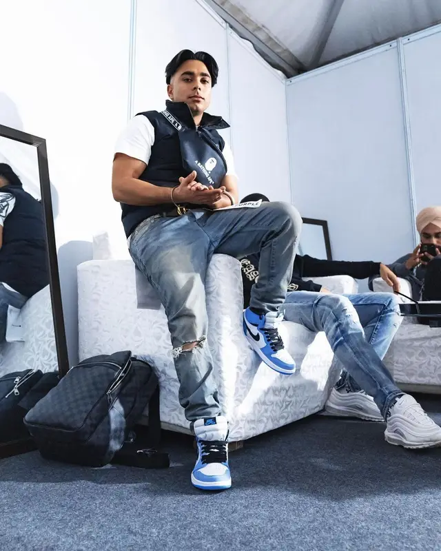 Gurinder Gill outfit in Purple Brand, Gucci, and Bape, 2021