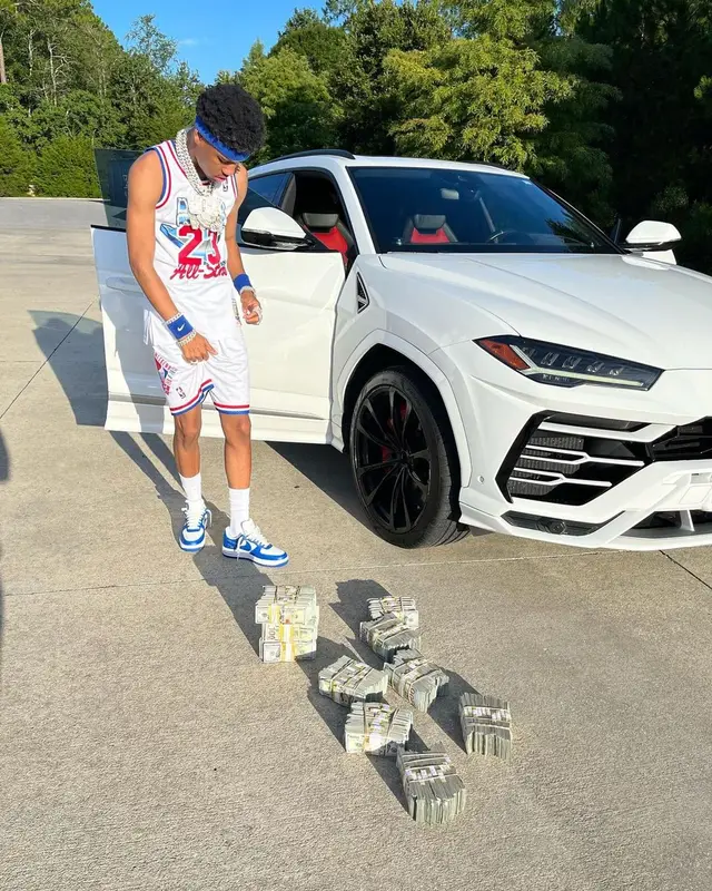 Nardo Wick outfit in Mitchell & Ness, Louis Vuitton, and Nike, 2022