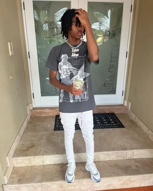 Lil Darius outfit in Purple Brand and Dior, 2022