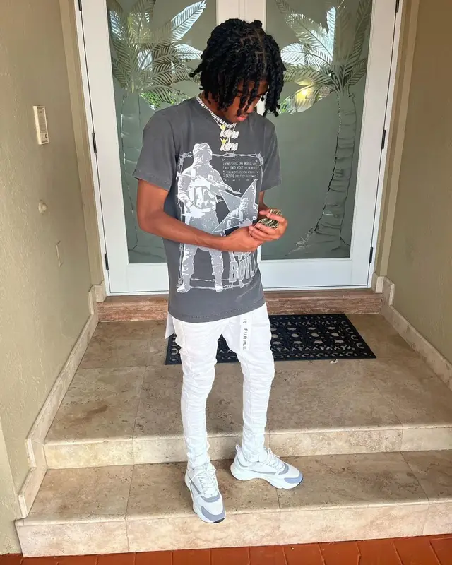 Lil Darius outfit in Purple Brand and Dior, 2022