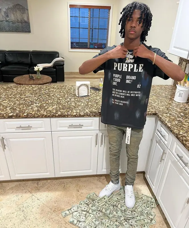 Lil Darius outfit in Purple Brand and Nike, 2022
