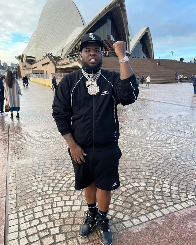 Maxo Kream outfit in Balenciaga, Jordan, and New Era, 2022