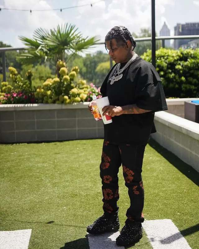 Rylo Rodriguez outfit in Fear of God, Denim Tears, and Loewe, 2022