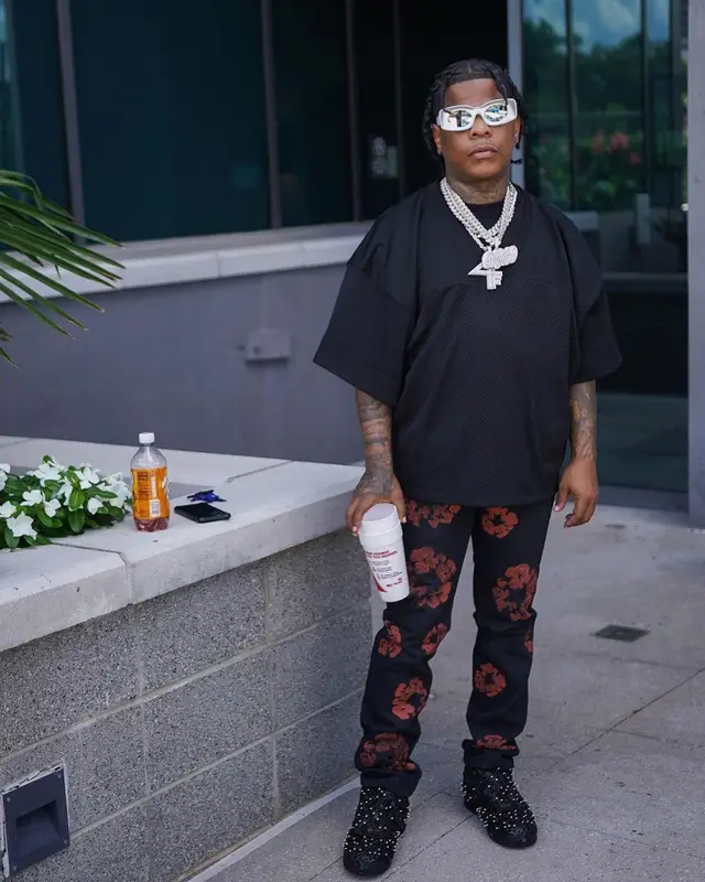 Rylo Rodriguez outfit in Fear of God, Denim Tears, and Loewe, 2022