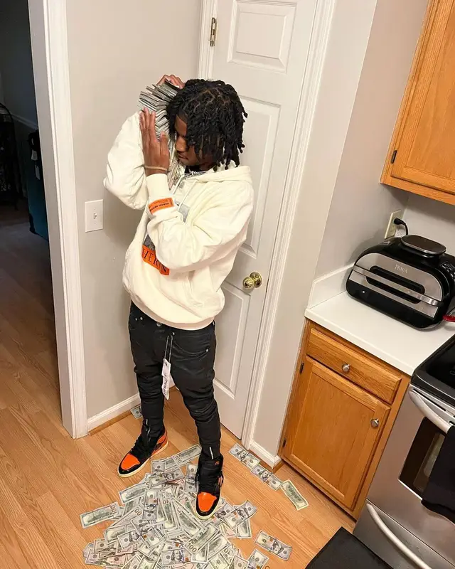 Lil Darius outfit in Heron Preston, Purple Brand, and Nike, 2022