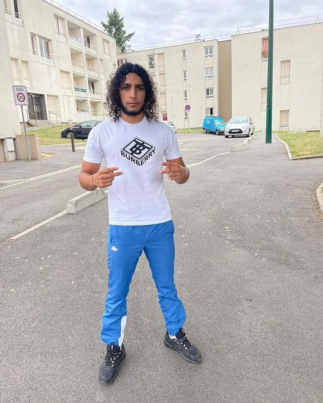 Isk outfit in Burberry, Lacoste, and Asics, 2022
