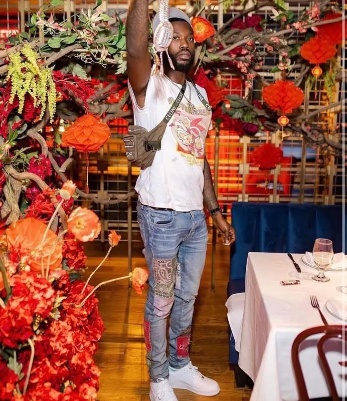Meek Mill outfit in Amiri, Louis Vuitton, and Celine, 2022
