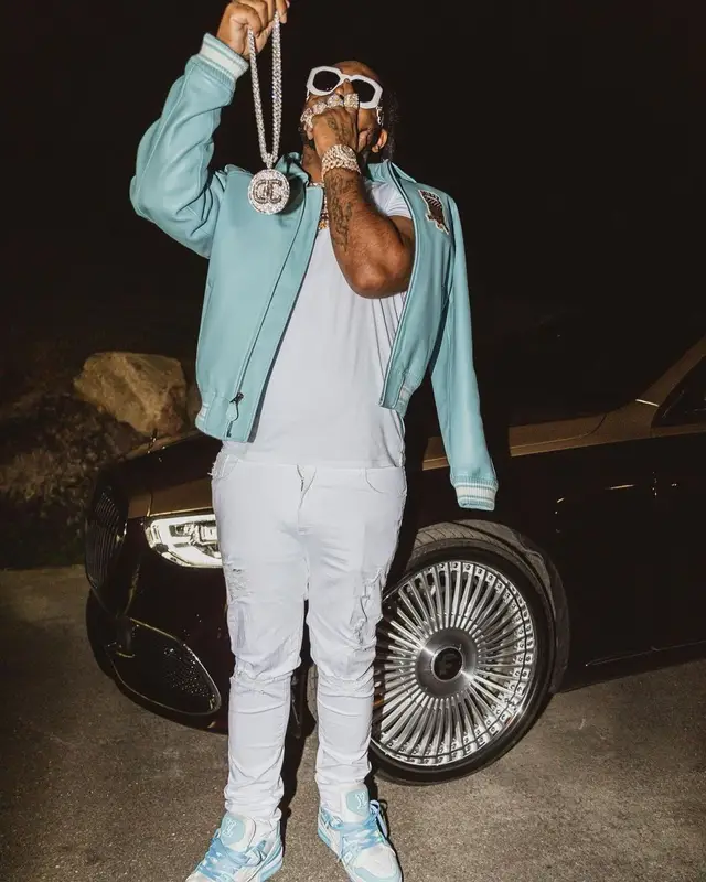 Icewear Vezzo outfit in Avirex, Louis Vuitton, and Versace, 2022