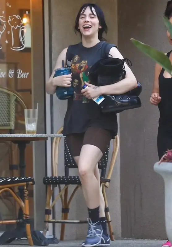 Billie Eilish outfit in Xero Shoes, Moon Boot, and Alyx, 2022