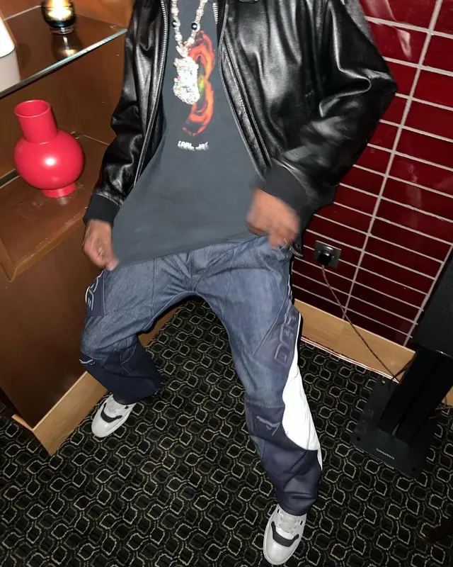 Travis Scott outfit in Yohji Yamamoto, Vintage, and Dainese, 2022