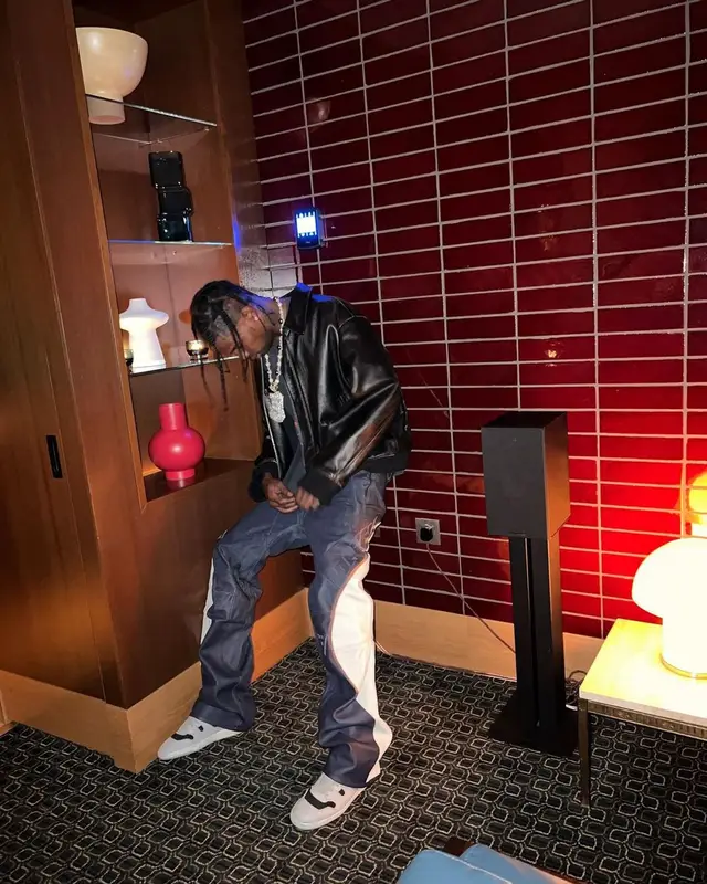 Travis Scott outfit in Yohji Yamamoto, Vintage, and Dainese, 2022