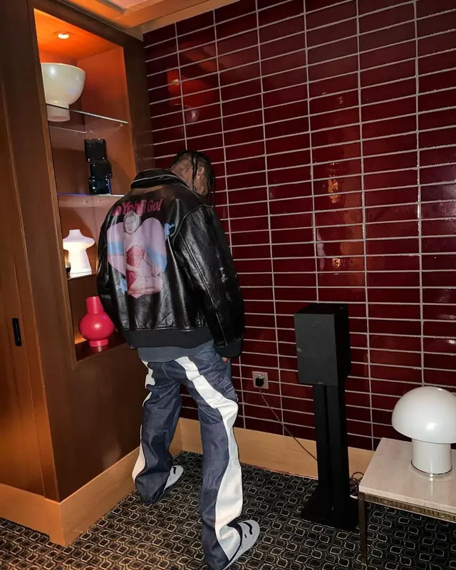 Travis Scott outfit in Yohji Yamamoto, Vintage, and Dainese, 2022