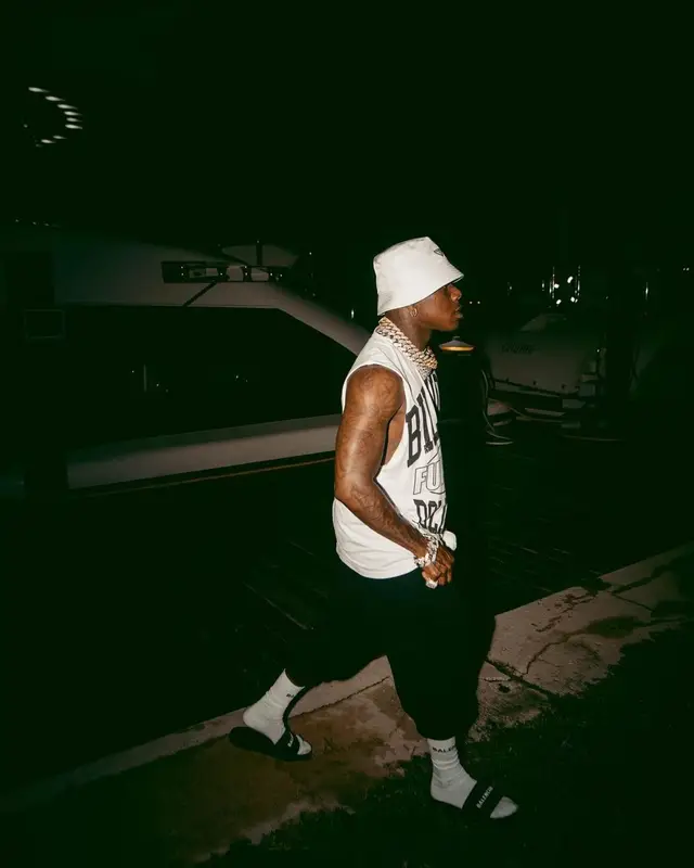 DaBaby outfit in Billion Dollar Baby, Prada, and Balenciaga, 2022