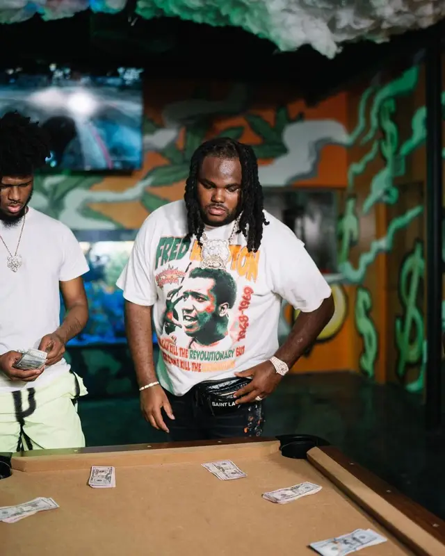 Tee Grizzley outfit in Amiri, Prada, and Saint Laurent, 2022