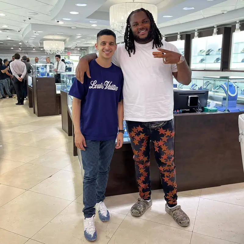 Tee Grizzley outfit in Burberry, Amiri, and Saint Laurent, 2022
