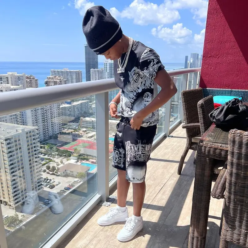 Lil 50 outfit in Givenchy, Nike, and Louis Vuitton, 2022