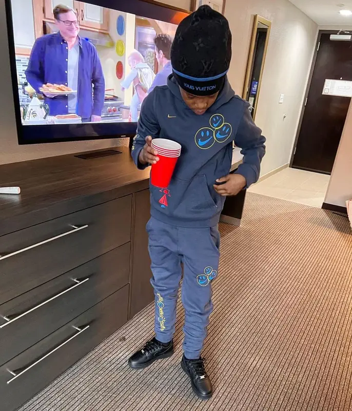 Lil 50 outfit in Nike and Louis Vuitton, 2022
