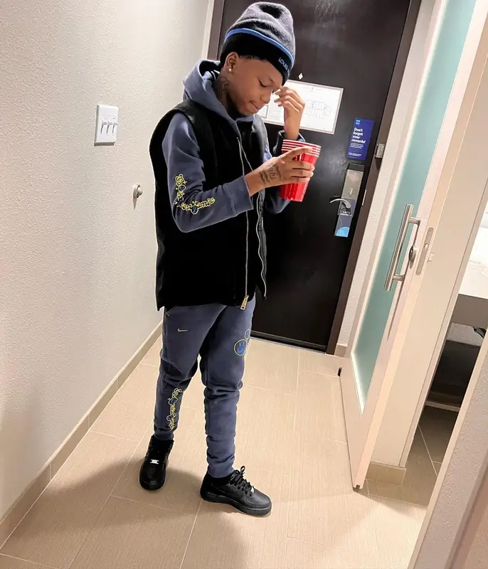 Lil 50 outfit in Nike and Louis Vuitton, 2022