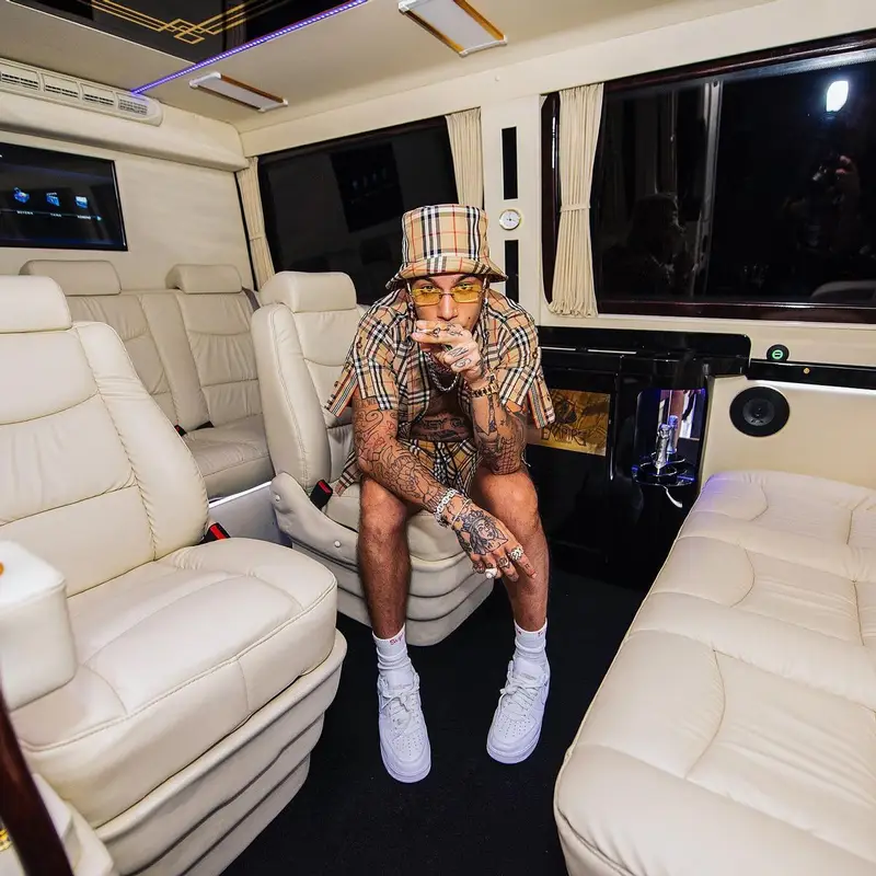 Sfera Ebbasta outfit in Cartier, Burberry, and Supreme, 2022