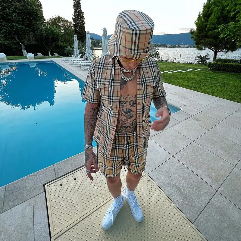 Sfera Ebbasta outfit in Cartier, Burberry, and Supreme, 2022