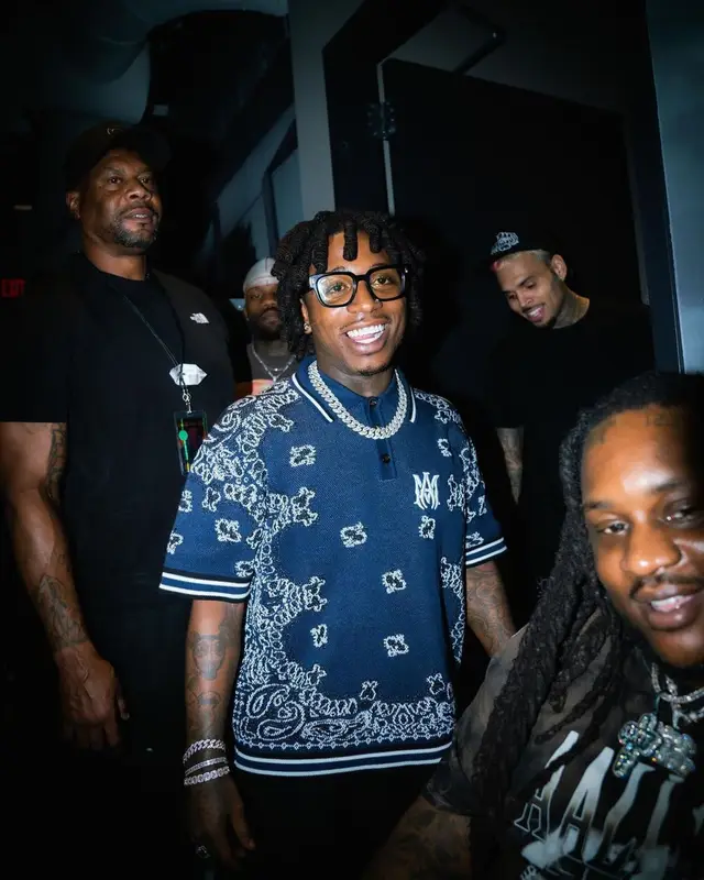 Jacquees outfit in Amiri, Louis Vuitton, and Nike, 2022