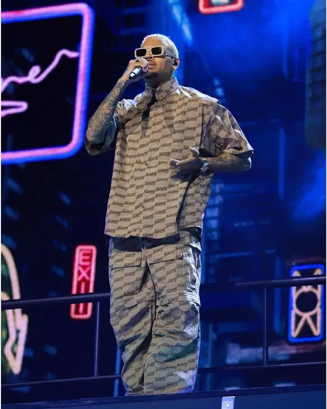 Chris Brown outfit in Balenciaga, Purple Brand, and Nike, 2022