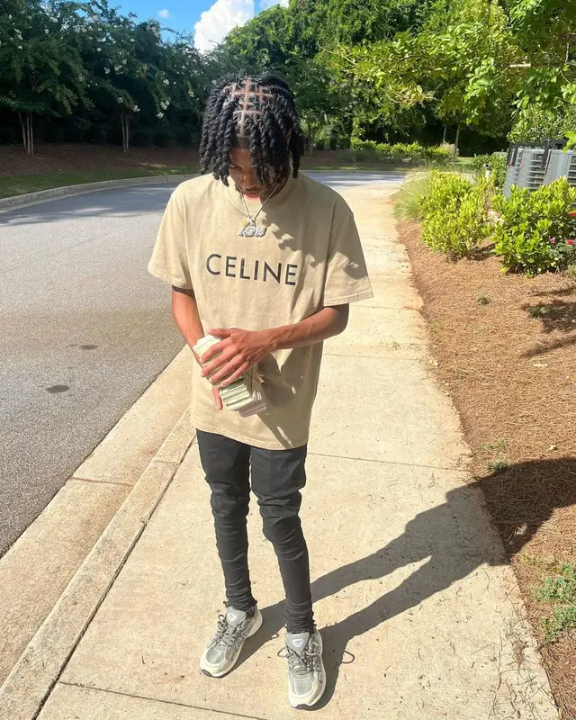Lil Darius outfit in Celine, Purple Brand, and Dior, 2022