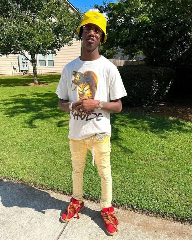 Yung Mal outfit in Rhude, Cartier, and Prada, 2022