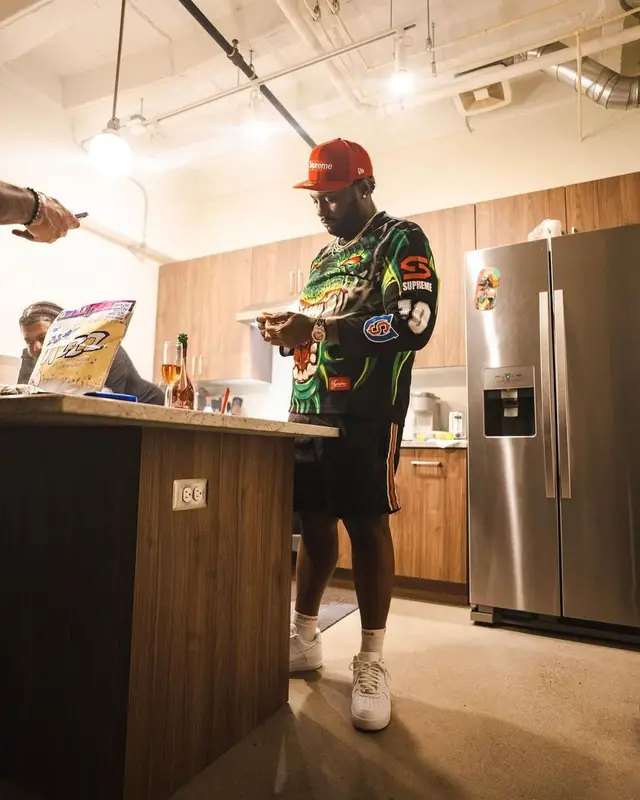 Peezy outfit in Gucci, Supreme, and New Era, 2022