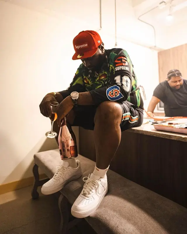 Peezy outfit in Gucci, Supreme, and New Era, 2022
