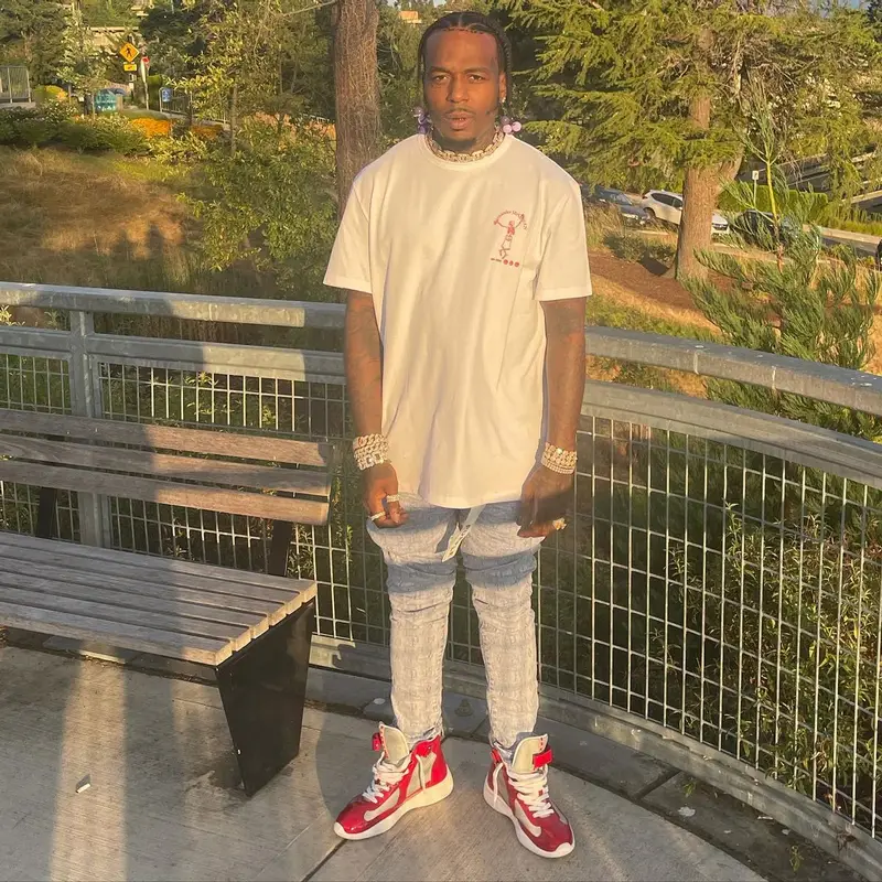 Sauce Walka outfit in Alexander McQueen, Purple Brand, and Prada, 2022