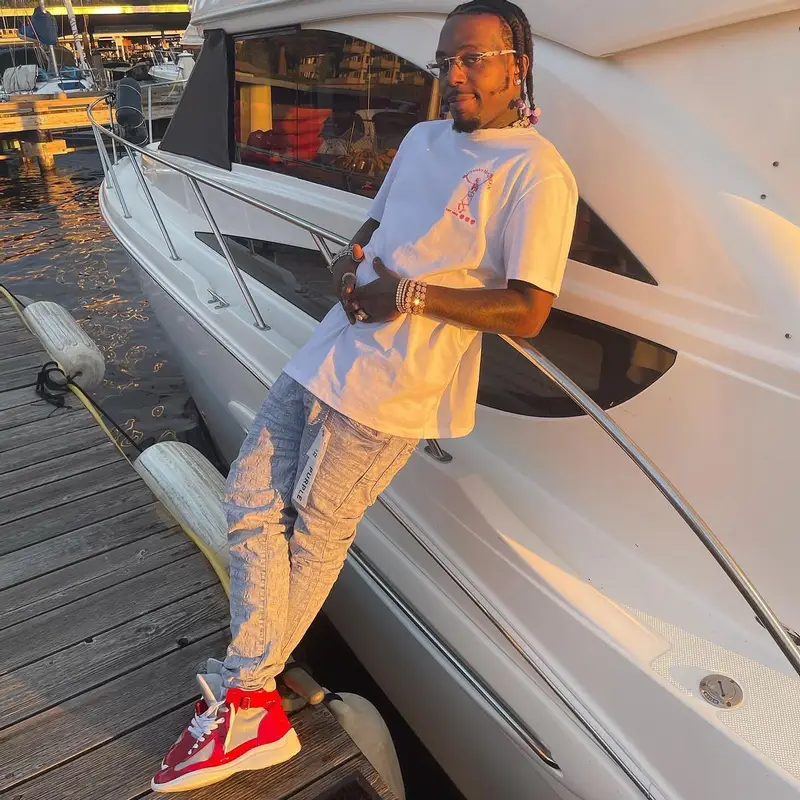 Sauce Walka outfit in Alexander McQueen, Purple Brand, and Prada, 2022