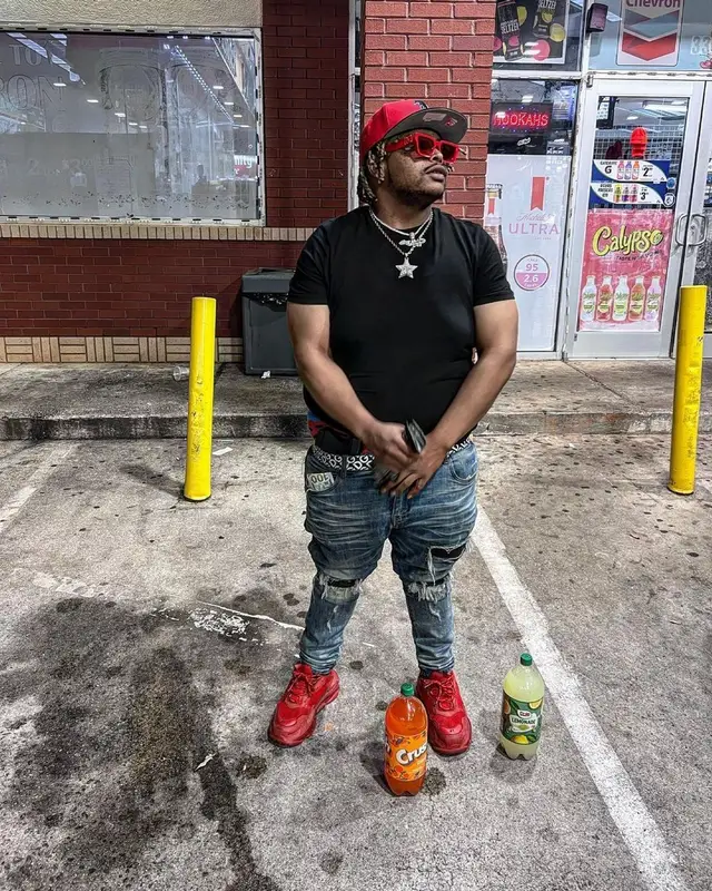 Guap Tarantino outfit in Dolce & Gabbana, Louis Vuitton, and New Era, 2022