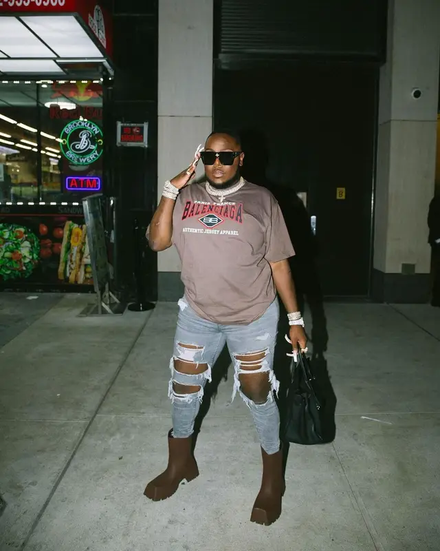Saucy Santana outfit in Balenciaga, Hermes, and Louis Vuitton, 2022