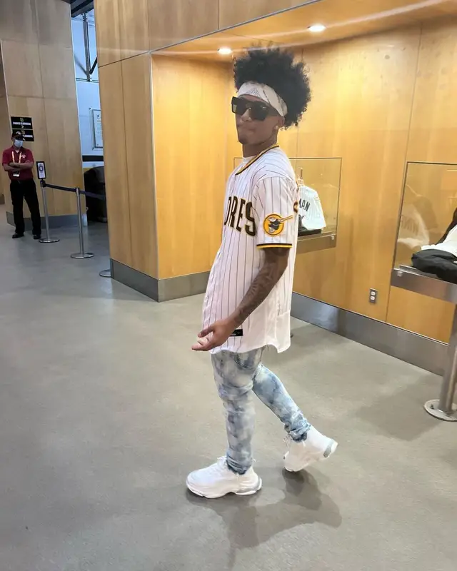 Mikey outfit in Nike, Purple Brand, and Louis Vuitton, 2022