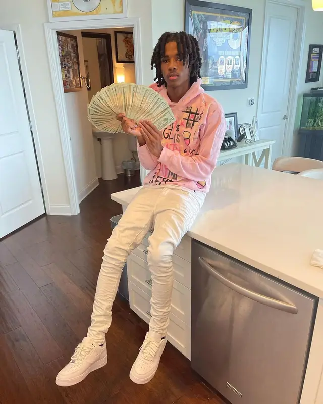 Lil Darius outfit in Osimiri, Purple Brand, and Nike, 2022