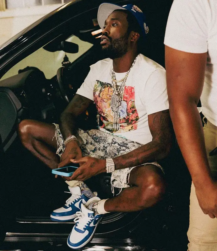 Meek Mill outfit in Louis Vuitton and Nike, 2022