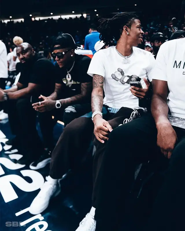 Ja Morant outfit in Kaws, Travis Scott Merch, and Uniqlo, 2022