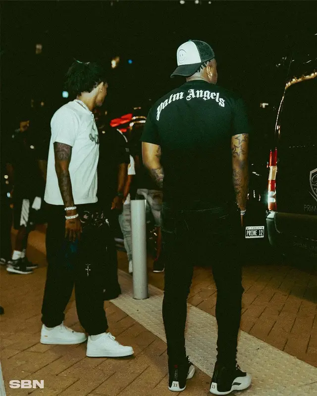 Ja Morant outfit in Kaws, Travis Scott Merch, and Uniqlo, 2022